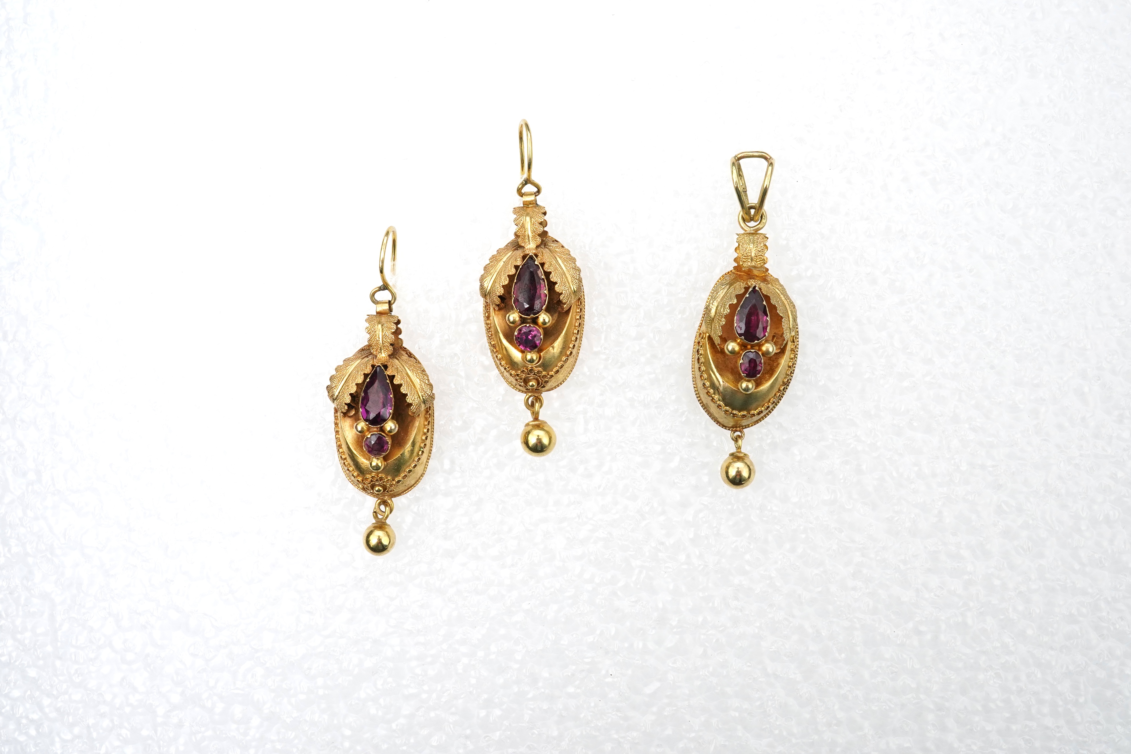 A Victorian gold and garnet demi-parure, mid 19th century